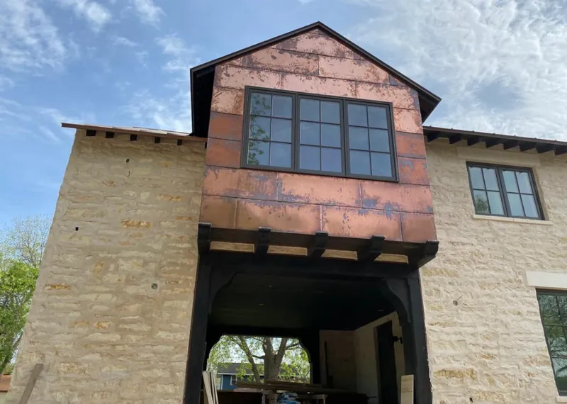 Copper metal panel facade on a stone building for Metal Roof Coating in Lemon Grove